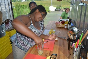 Kierra squeezes lemons for one of the dishes